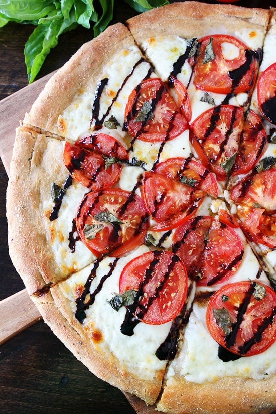 Caprese Pizza Recipe Caprese Pizza Recipe on twopeasandtheirpod.com This classic pizza recipe is always a favorite! #pizza