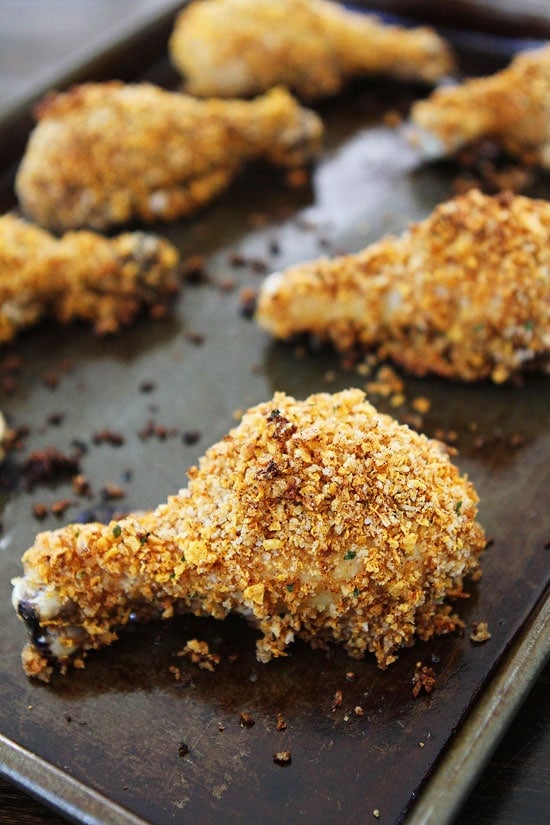 Buttermilk Oven "Fried" Chicken Recipe on twopeasandtheirpod.com Love this skinny recipe for fried chicken! It is easy to make too! #chicken #dinner baked fried chicken drumsticks on baking sheet
