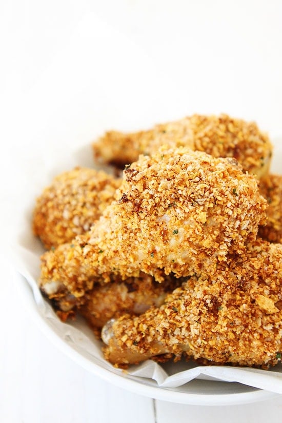 Buttermilk Oven "Fried" Chicken Recipe on twopeasandtheirpod.com Love this skinny recipe for fried chicken! It tastes like regular fried chicken! #dinner healthy fried chicken drumsticks on serving dish