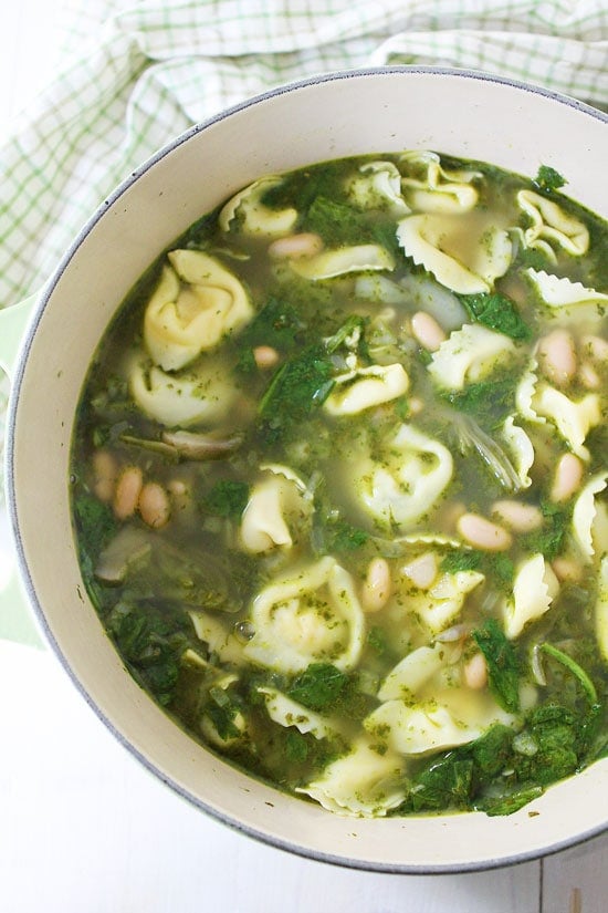 Spinach Artichoke Pesto Tortellini Soup Recipe on twopeasandtheirpod.com This easy soup recipe is perfect for a chilly day! #soup Spinach Artichoke Pesto Tortellini Soup Recipe on twopeasandtheirpod.com