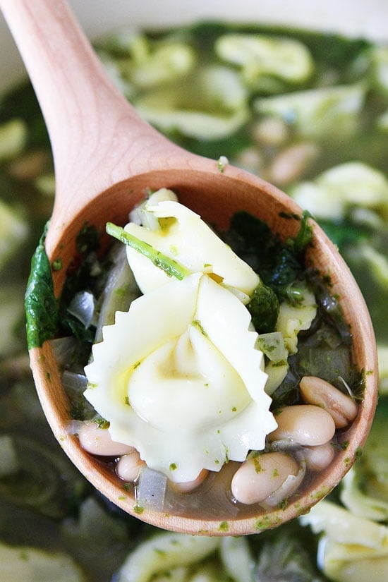 Spinach Artichoke Pesto Tortellini Soup Recipe on twopeasandtheirpod.com This tortellini soup is full of flavor and is so easy to make! #soup Spinach Artichoke Pesto Tortellini Soup Recipe on twopeasandtheirpod.com