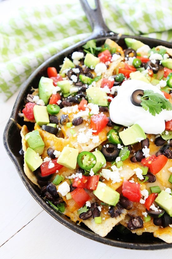 Three Cheese Skillet Nachos Recipe on twopeasandtheirpod.com Love these easy and cheesy nachos! Perfect for game day! Three Cheese Skillet Nachos Recipe on twopeasandtheirpod.com