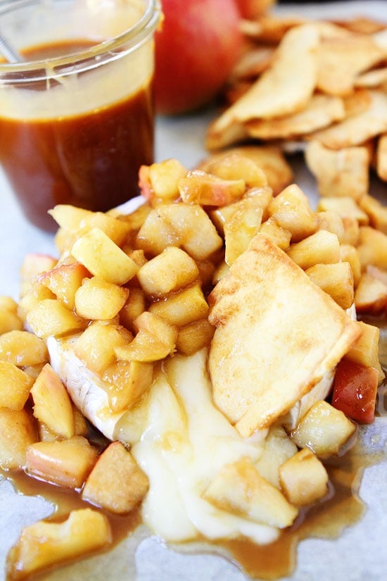 Baked Brie with Apples and Salted Caramel Recipe on twopeasandtheirpod.com The perfect party appetizer! Baked Brie with Apples and Salted Caramel Recipe on twopeasandtheirpod.com
