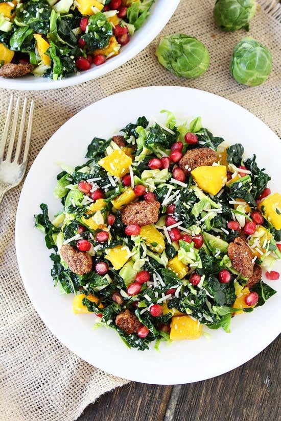 Kale and Brussels Sprouts Salad with Butternut Squash, Pomegranate, and Candied Pecans Recipe on twopeasandtheirpod.com The perfect salad for the holidays! Kale and Brussels Sprouts Salad with Butternut Squash, Pomegranate, and Candied Pecans Recipe on twopeasandtheirpod.com