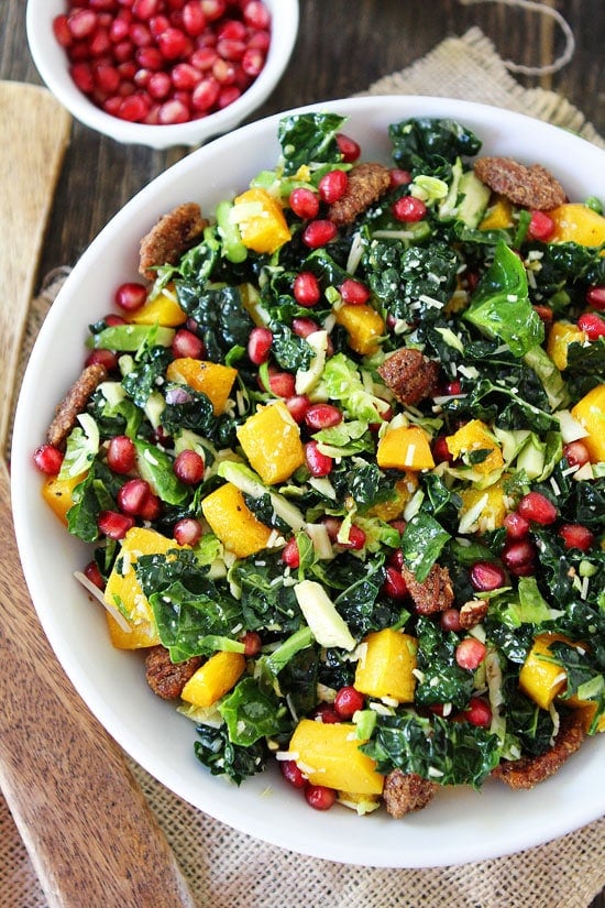 Kale and Brussels Sprouts Salad with Butternut Squash, Pomegranate, and Candied Pecans Recipe on twopeasandtheirpod.com Everyone will want this salad recipe! It is SO good! Kale and Brussels Sprouts Salad with Butternut Squash, Pomegranate, and Candied Pecans Recipe on twopeasandtheirpod.com