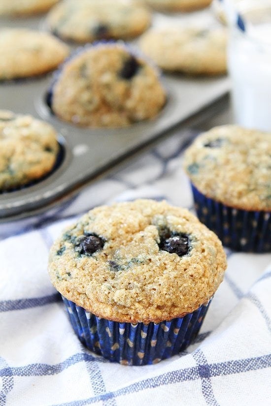 Vegan Banana Blueberry Muffins Recipe on twopeasandtheirpod.com Kids and adults love these healthy muffins! They freeze beautifully too! vegan banana muffins dotted with blueberries