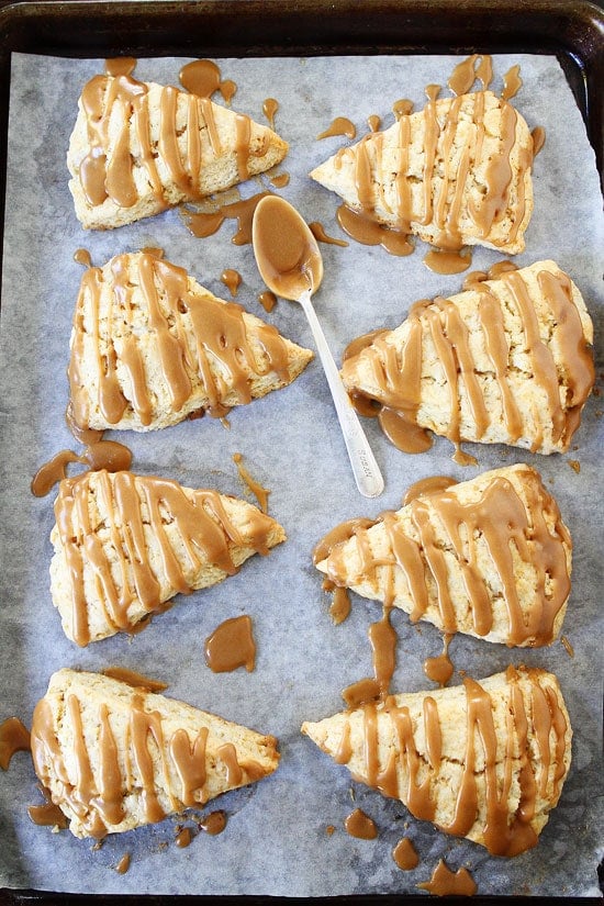 Maple Scones Recipe on twopeasandtheirpod.com Light, fluffy, and sweet scones! The perfect breakfast treat! Maple Scones on baking sheet
