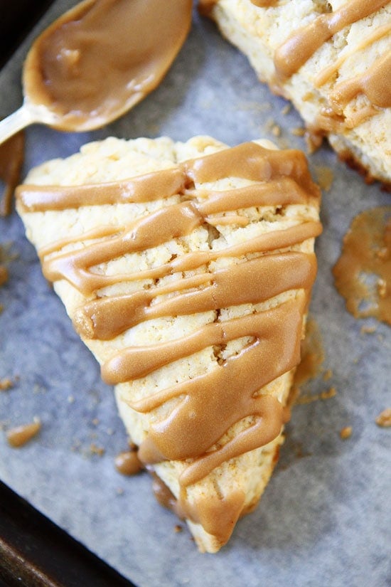 Maple Scones Recipe on twopeasandtheirpod.com Light and fluffy scones drizzled with a sweet maple glaze! LOVE these scones! Maple Scones