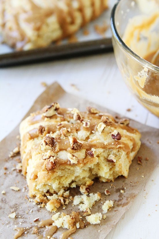 Maple Scones Recipe on twopeasandtheirpod.com Light and fluffy scones drizzled with a sweet maple glaze and sprinkled with candied pecans! The BEST scones! Easy Maple Scones Recipe