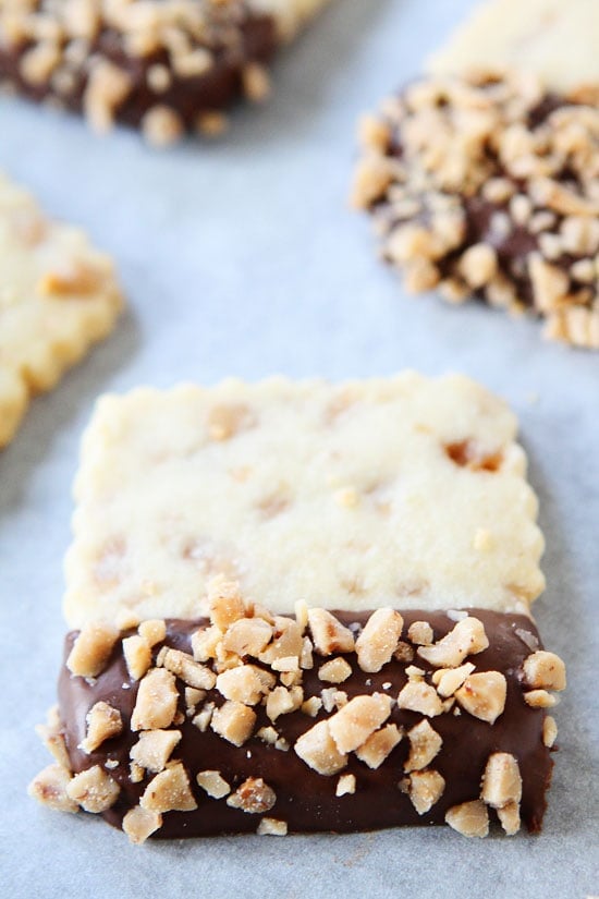 Chocolate Dipped Toffee Shortbread Recipe on twopeasandtheirpod.com These cookies are easy and fun to make! Chocolate Dipped Toffee Shortbread Recipe