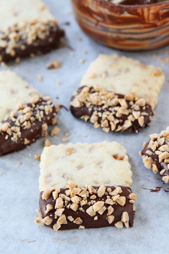 Chocolate Dipped Toffee Shortbread Recipe on twopeasandtheirpod.com Buttery, crisp toffee shortbread dipped in chocolate! These cookies are fun to make and fun to eat! Chocolate Dipped Toffee Shortbread Recipe on twopeasandtheirpod.com