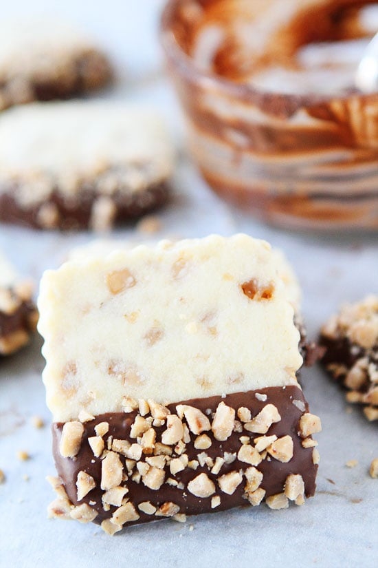Chocolate Dipped Toffee Shortbread Recipe on twopeasandtheirpod.com Buttery, crisp toffee shortbread dipped in chocolate! These cookies make a great holiday gift! Chocolate Dipped Toffee Shortbread Recipe on twopeasandtheirpod.com