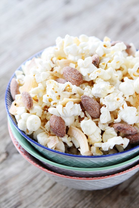 Toasted Coconut Kettle Corn Recipe on twopeasandtheirpod.com This easy and healthy popcorn is great for game day, movie night, or every day snacking! Toasted Coconut Kettle Corn Recipe on twopeasandtheirpod.com