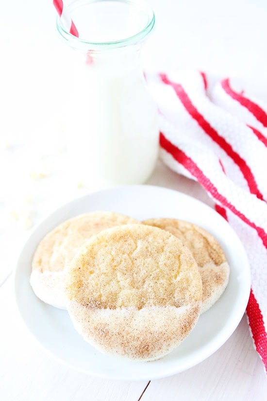 White Chocolate Dipped Snickerdoodles Recipe on twopeasandtheirpod.com The white chocolate makes these snickerdoodle cookies extra special! They are our favorite! White Chocolate Dipped Snickerdoodles Recipe
