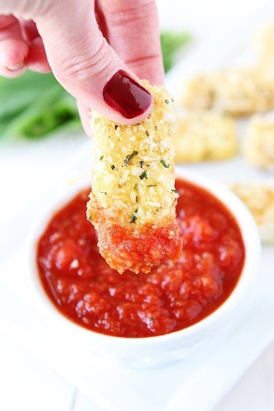 Baked Mozzarella Sticks Recipe on twopeasandtheirpod.com These easy baked mozzarella sticks are a great snack for any party! Baked Mozzarella Sticks Recipe