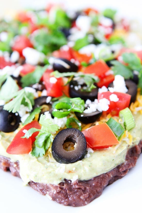 Mexican Layer Dip Recipe on twopeasandtheirpod.com This easy dip recipe is a family favorite! It is perfect for entertaining! Mexican Layer Dip Recipe on twopeasandtheirpod.com