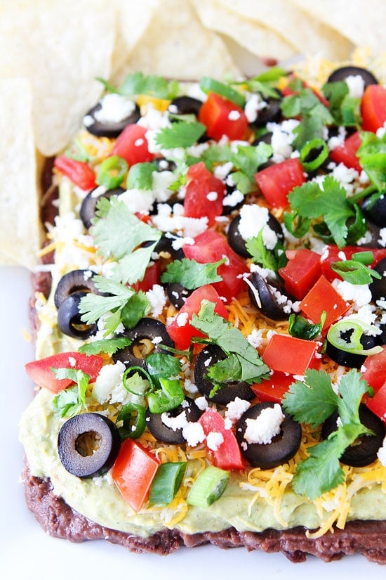 Mexican Layer Dip Recipe on twopeasandtheirpod.com Grab a chip and get dipping! This easy 7 Layer Dip is always a favorite! Mexican Layer Dip Recipe on twopeasandtheirpod.com