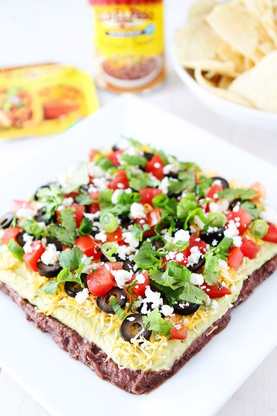 Mexican Layer Dip Recipe on twopeasandtheirpod.com 7 Layer Dip is always a hit! Serve with tortilla chips for an easy party appetizer! 7 Layer Dip Recipe