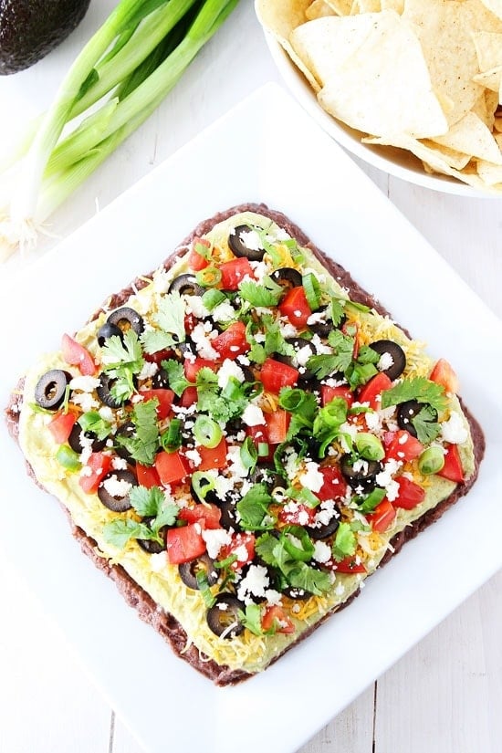 Mexican Layer Dip Recipe on twopeasandtheirpod.com This 7 layer dip is always a hit at parties and it is easy to make too! Mexican Layer Dip Recipe on twopeasandtheirpod.com