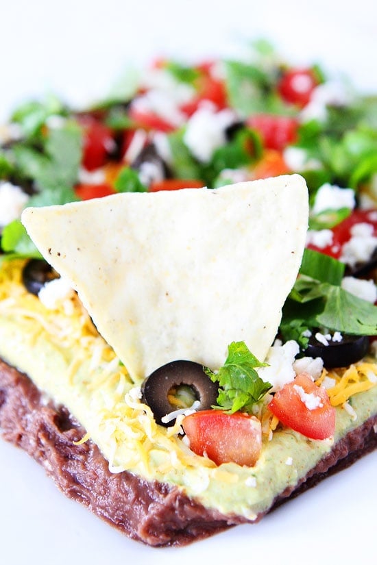 Mexican Layer Dip Recipe on twopeasandtheirpod.com This easy dip is great for game day, parties, or every day snacking! Mexican Layer Dip Recipe