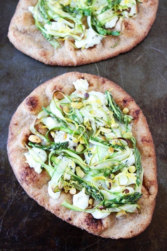 Asparagus, Goat Cheese, and Pistachio Flatbread Recipe on twopeasandtheirpod.com This easy flatbread recipe is great for lunch, dinner, or as a party appetizer! Asparagus, Goat Cheese, and Pistachio Flatbread Recipe