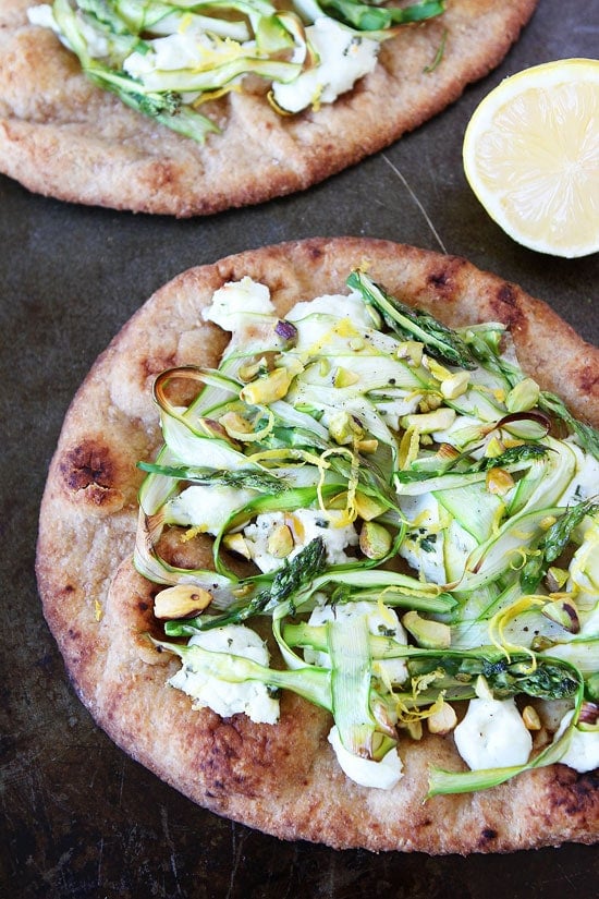 Asparagus, Goat Cheese, and Pistachio Flatbread Recipe on twopeasandtheirpod.com This easy flatbread recipe is perfect for spring! Asparagus, Goat Cheese, and Pistachio Flatbread Recipe