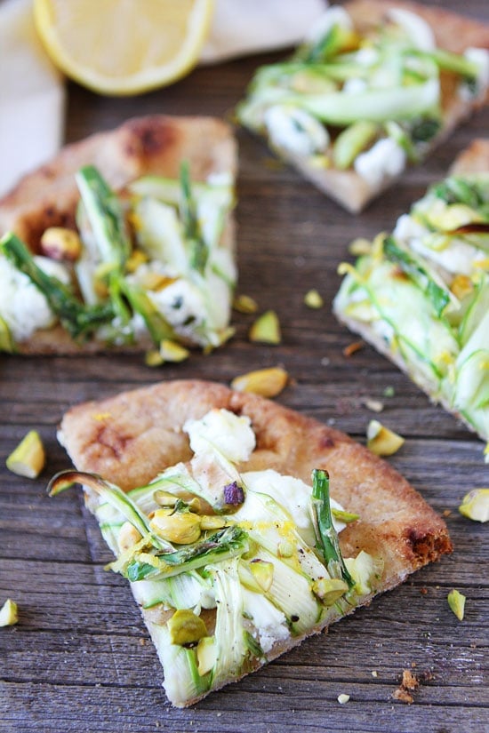 Asparagus, Goat Cheese, and Pistachio Flatbread Recipe on twopeasandtheirpod.com This flatbread is easy to make and SO good! Asparagus, Goat Cheese, and Pistachio Flatbread Recipe
