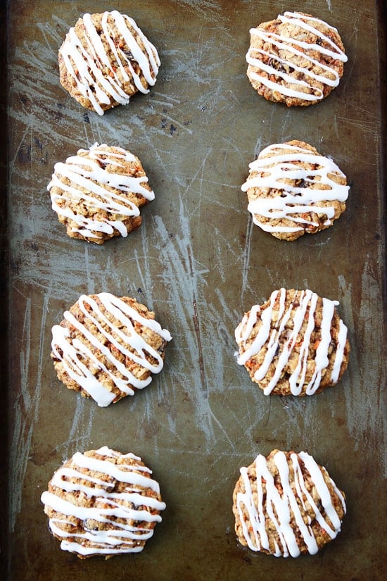 Carrot Cake Oatmeal Cookies with Cream Cheese Glaze Recipe on twopeasandtheirpod.com If you like carrot cake, you will LOVE these cookies! A fun treat for Easter! Carrot Cake Oatmeal Cookies with Cream Cheese Glaze Recipe
