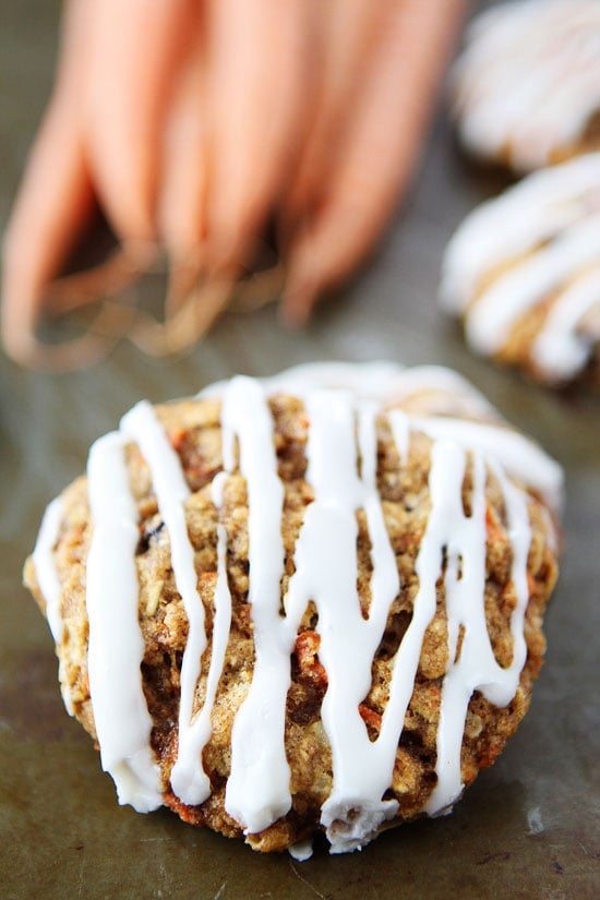 Carrot Cake Oatmeal Cookies with Cream Cheese Glaze Recipe on twopeasandtheirpod.com If you like carrot cake, you will LOVE these cookies! They are the perfect treat for spring! Carrot Cake Oatmeal Cookies with Cream Cheese Glaze Recipe