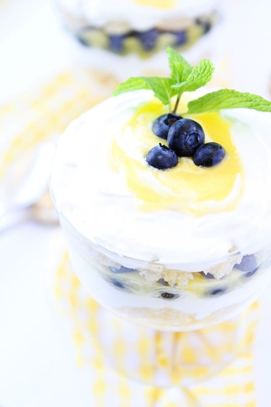 Lemon Blueberry Trifle Recipe on twopeasandtheirpod.com Lemon cake, lemon curd, whipped cream, and blueberries are layered to create a beautiful and delicious dessert! Lemon Blueberry Trifle Recipe
