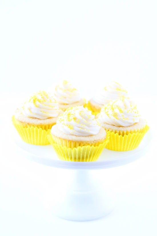 Lemon Curd Cupcakes Recipe on twopeasandtheirpod.com Lemon cupcakes filled with lemon curd and topped with buttercream frosting. Everyone LOVES these cupcakes! Lemon Curd Cupcakes Recipe
