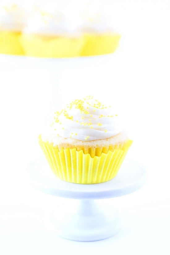 Lemon Curd Cupcakes Recipe on twopeasandtheirpod.com Lemon cupcakes filled with lemon curd and topped with buttercream frosting. Lemon Cupcake Recipe