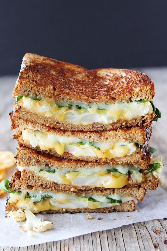 Roasted Cauliflower Grilled Cheese Recipe on twopeasandtheirpod.com Roasted cauliflower, onions, arugula, lemon mustard ailoi, and lots of cheese! This grilled cheese is amazing! Cauliflower Grilled Cheese Sandwich
