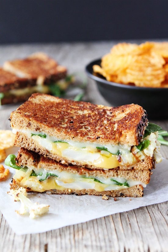 Roasted Cauliflower Grilled Cheese Recipe on twopeasandtheirpod.com Roasted cauliflower, arugula, lemon mustard aioli, and lots of cheese! This grilled cheese is SO good! Roasted Cauliflower Grilled Cheese Recipe