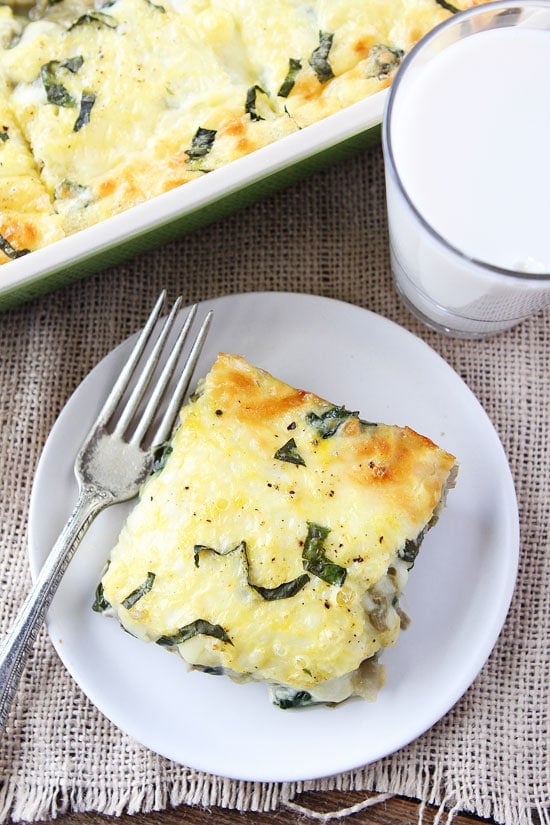 Spinach Artichoke Egg Casserole Recipe on twopeasandtheirpod.com This easy egg casserole is great for holidays! Our family loves it! Spinach Artichoke Egg Casserole Recipe