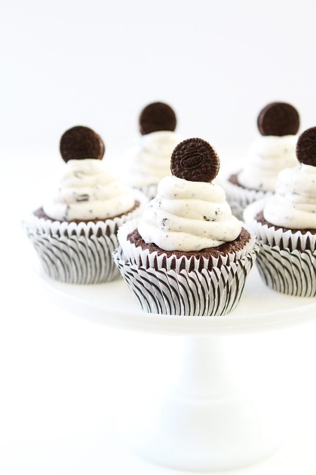 Cookies and Cream Cupcakes Recipe on twopeasandtheirpod.com Chocolate cupcakes with cookies and cream frosting and an Oreo surprise inside! These cupcakes are AMAZING! Cookies and Cream Cupcakes Recipe