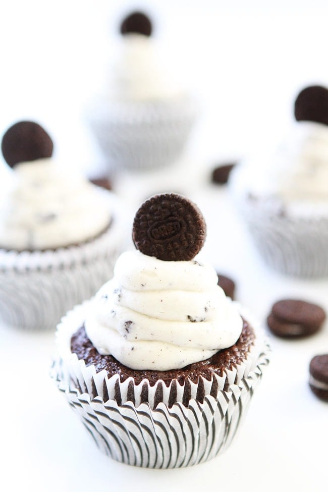 Cookies and Cream Cupcakes Recipe on twopeasandtheirpod.com Chocolate cupcakes with cookies and cream frosting and an Oreo surprise inside! These cupcakes are fun to make and fun to eat! Cookies and Cream Cupcakes Recipe