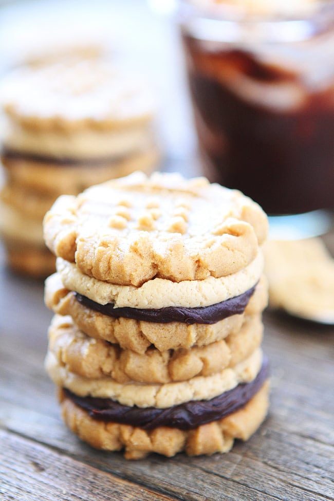 Flourless Peanut Butter Chocolate Ganache Sandwich Cookies Recipe on twopeasandtheirpod.com The BEST peanut butter cookies you will ever eat! Flourless Peanut Butter Chocolate Ganache Sandwich Cookies Recipe