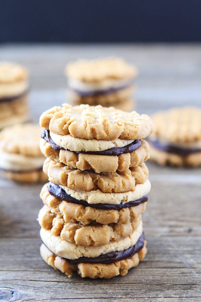 Flourless Peanut Butter Chocolate Ganache Sandwich Cookies Recipe on twopeasandtheirpod.com The BEST peanut butter cookies! Flourless Peanut Butter Chocolate Ganache Sandwich Cookies