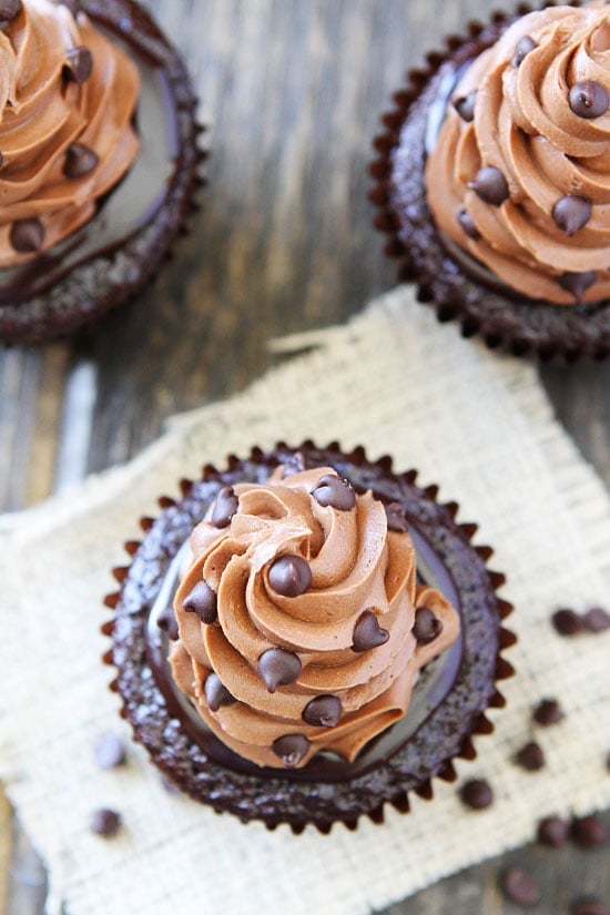 Ultimate Chocolate Cupcake Recipe on twopeasandtheirpod.com The BEST chocolate cupcake you will ever eat. Chocolate cupcake with silky chocolate ganache and the most amazing chocolate buttercream. Chocolate Cupcake Recipe with Ganache, Frosting, and Mini Chips