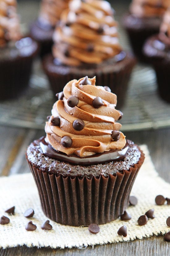 Ultimate Chocolate Cupcake Recipe on twopeasandtheirpod.com The BEST chocolate cupcake recipe. You have to make these! Ultimate Chocolate Cupcakes with chocolate ganache, buttercream frosting, and chocolate chips