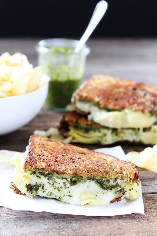 Pesto, Artichoke, and Havarti Grilled Cheese Recipe on twopeasandtheirpod.com This simple grilled cheese sandwich is loaded with flavor. A MUST make! Pesto, Artichoke, and Havarti Grilled Cheese Sandwich