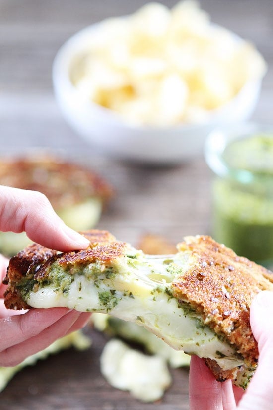 Pesto, Artichoke, and Havarti Grilled Cheese Recipe on twopeasandtheirpod.com This simple grilled cheese is loaded with flavor and LOTS of cheese! SO good! Pesto, Artichoke, and Havarti Grilled Cheese Recipe