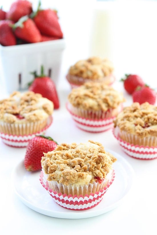 Strawberry Cheesecake Muffin Recipe on twopeasandtheirpod.com Strawberry muffins with a sweet cheesecake filling and graham cracker streusel topping. These muffins are amazing! Strawberry Cheesecake Muffin Recipe