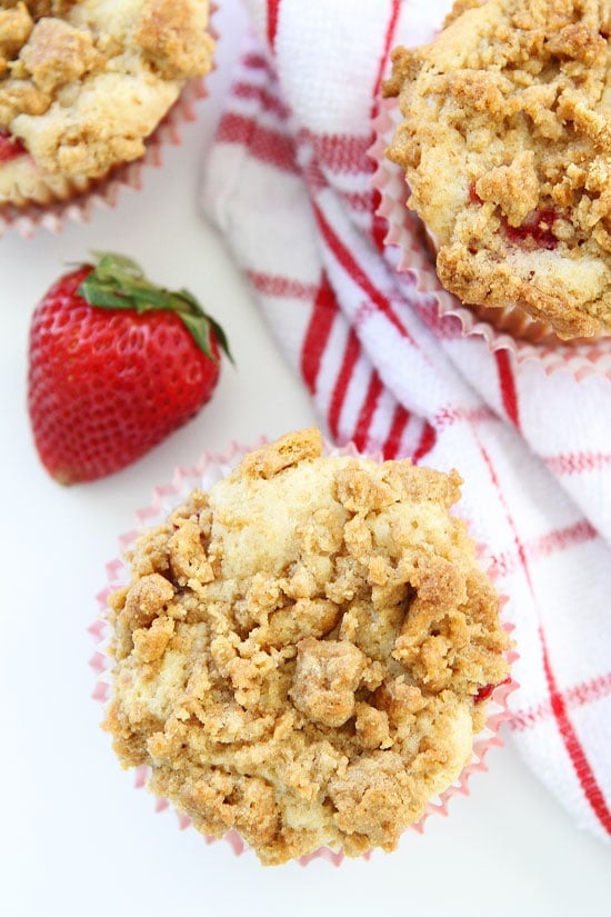 Strawberry Cheesecake Muffin Recipe on twopeasandtheirpod.com Strawberry muffins with a sweet cheesecake filling and graham cracker streusel topping. Strawberry Cheesecake Muffins