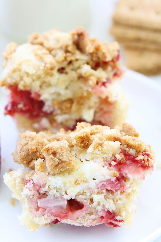Strawberry Cheesecake Muffins on twopeasandtheirpod.com Strawberry muffins with a sweet cheesecake filling and graham cracker streusel topping. These muffins are always a hit! Make them today! Strawberry Cheesecake Muffins
