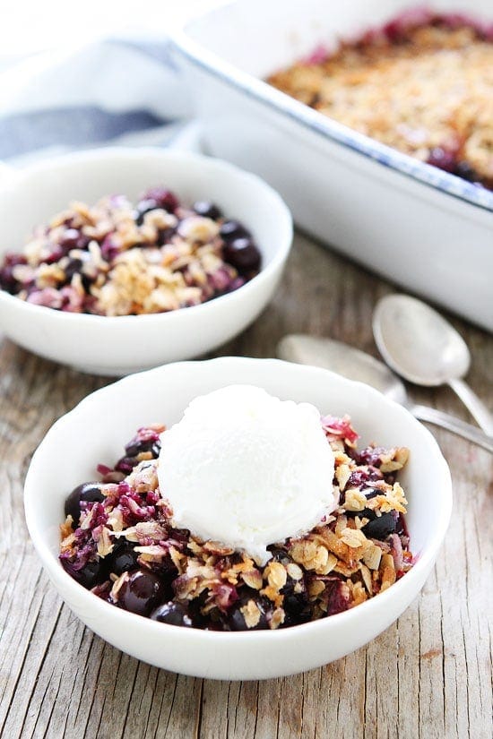 Blueberry Coconut Crisp Recipe on twopeasandtheirpod.com This easy blueberry crisp recipe is always a favorite! Top with ice cream or yogurt for an extra special dessert! Blueberry Coconut Crisp Recipe