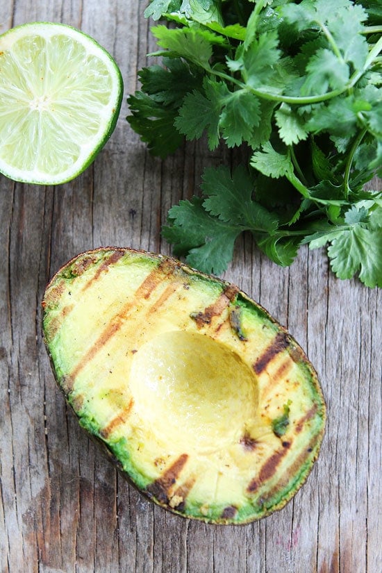 Grilled Avocado and Vegetable Tacos Recipe on twopeasandtheirpod.com The grilled avocado makes these veggie tacos extra tasty! Grilled Avocado and Vegetable Tacos Recipe