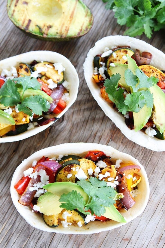 Grilled Avocado and Vegetable Tacos Recipe on twopeasandtheirpod.com These healthy, vegetarian tacos will be a favorite this summer! Grilled Avocado and Vegetable Tacos Recipe