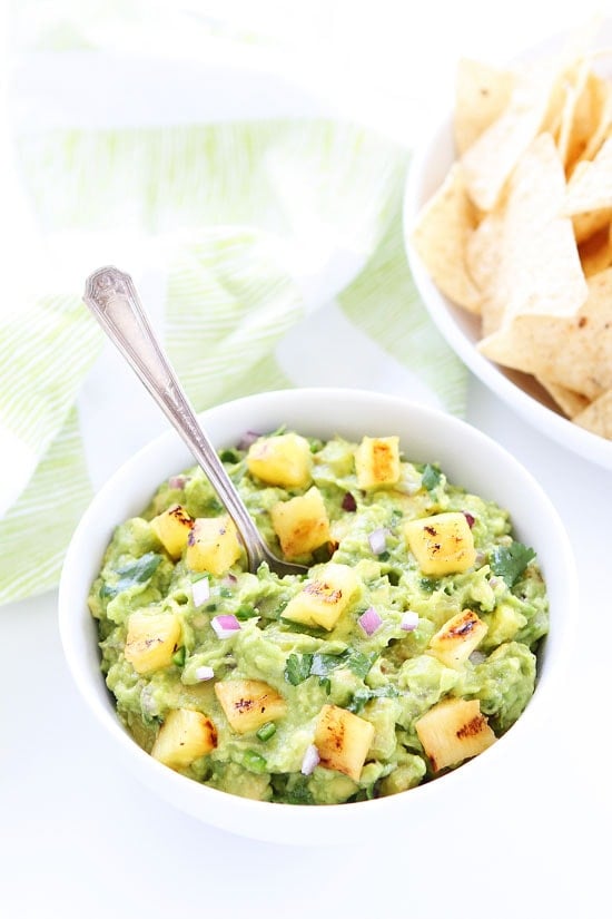 Grilled Pineapple Guacamole Recipe on twopeasandtheirpod.com Make this easy guacamole recipe for all of our summer parties! It is sure to be a hit! Grilled Pineapple Guacamole Recipe